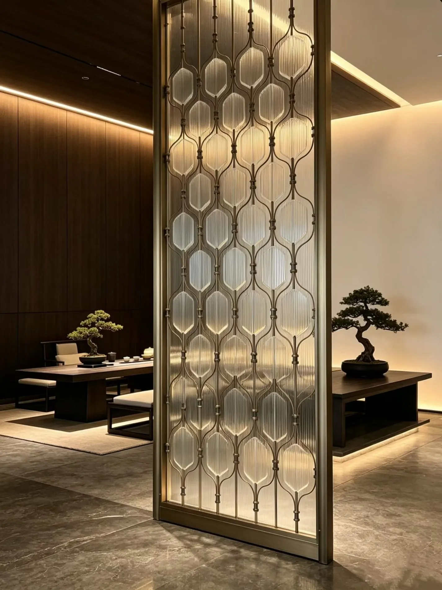 Decorative metal and fluted glass screen in a hospitality interior